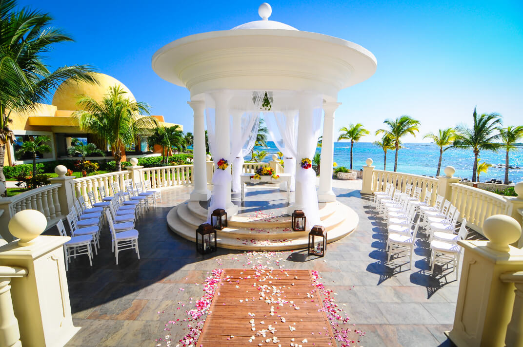 A white gazebo is decorated for a wedding at the Barceló Maya Palace hotel.