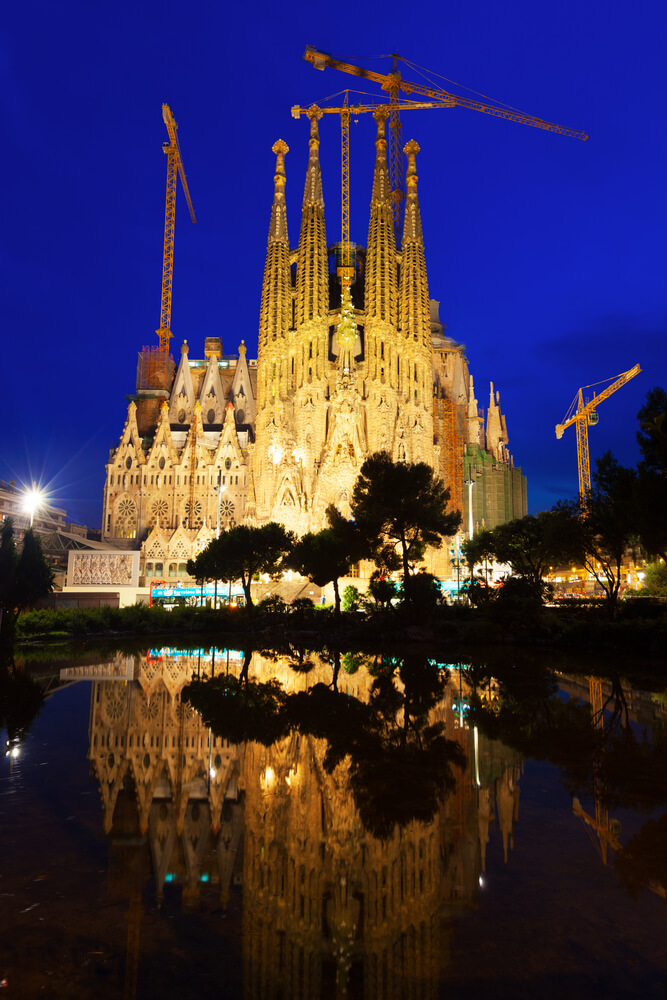 Eixample: The Sagrada Familia church lit up at night