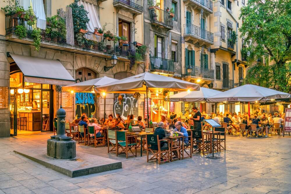 El Born: A view of people dining out on a terrace of a restaurant in Barcelona