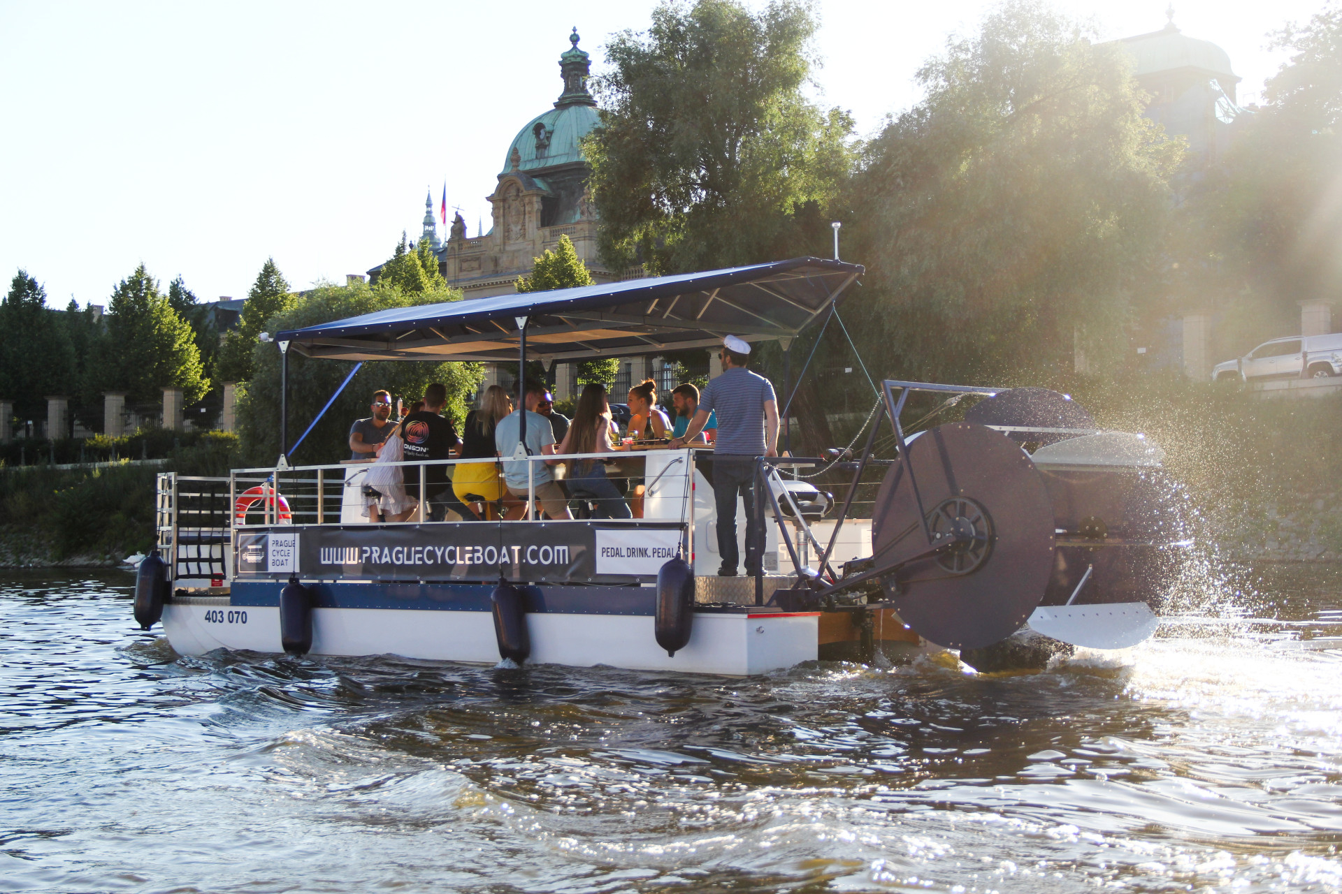People enjoying a beer on a Prague beer boat