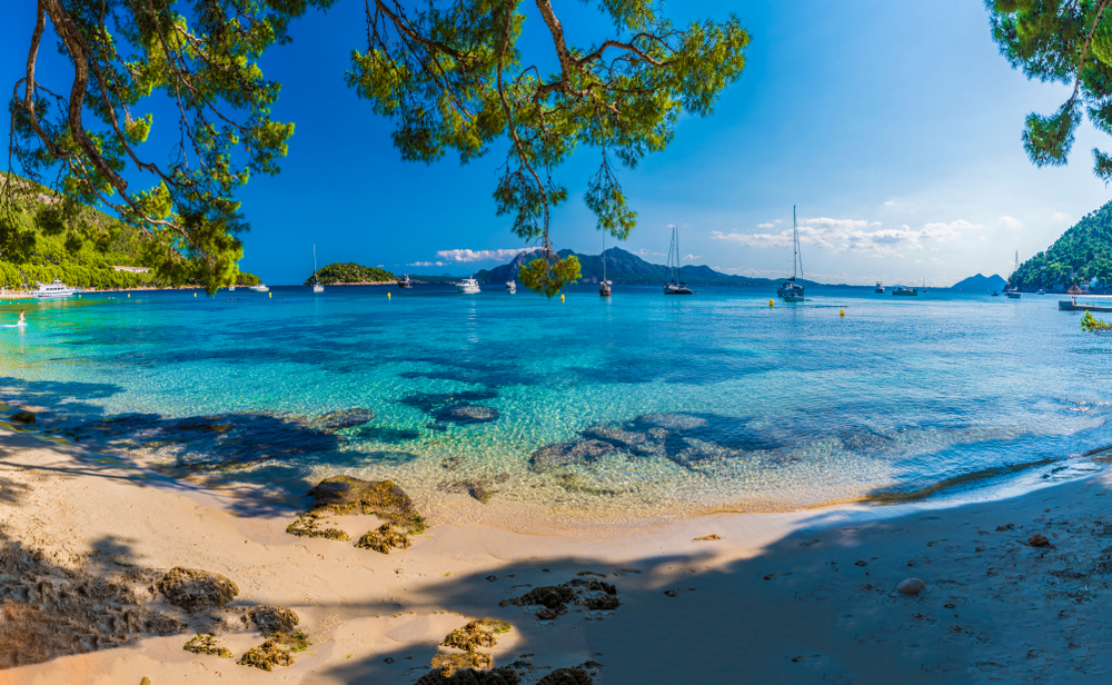 Best Beaches in Mallorca: A white sand beach and blue ocean in Mallorca