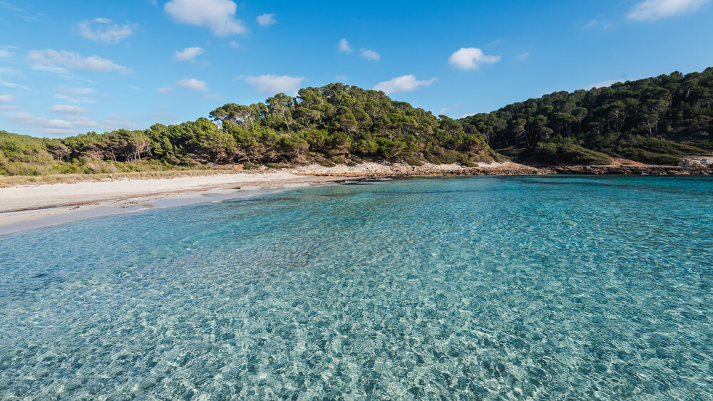 Secret beaches Menorca: The pristine waters of Cala Trebaluger, Menorca