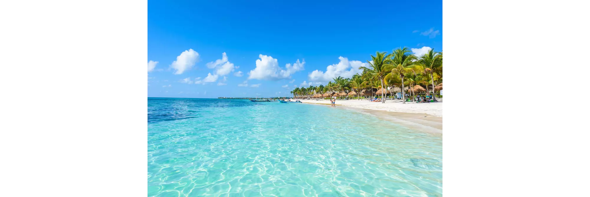 Cancun beach: A close-up of the white sand beach with topaz waters in Cancún