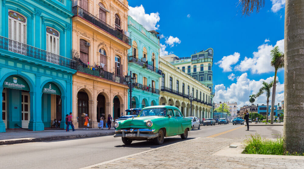Best islands for a honeymoon: Typical Cuban street with an old car