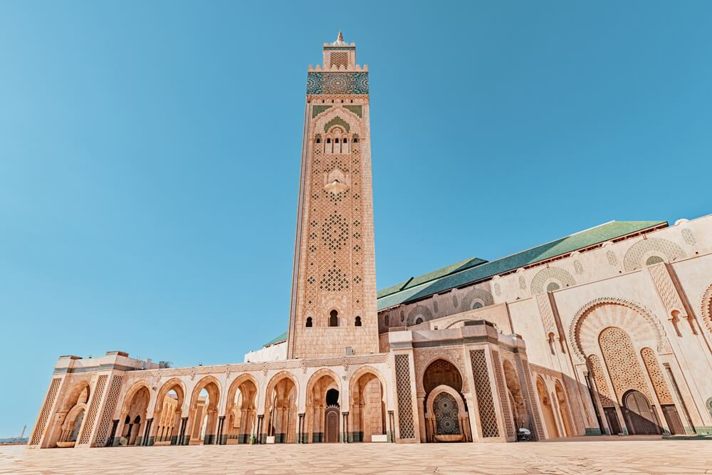 Casablanca: The golden stone and tiled facade of the Hassan II mosque