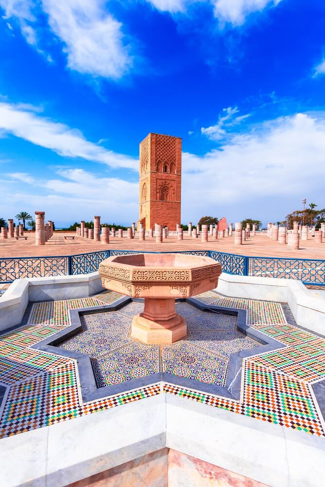 Rabat: A star-shaped mosaic fountain with an Islamic tower in the distance