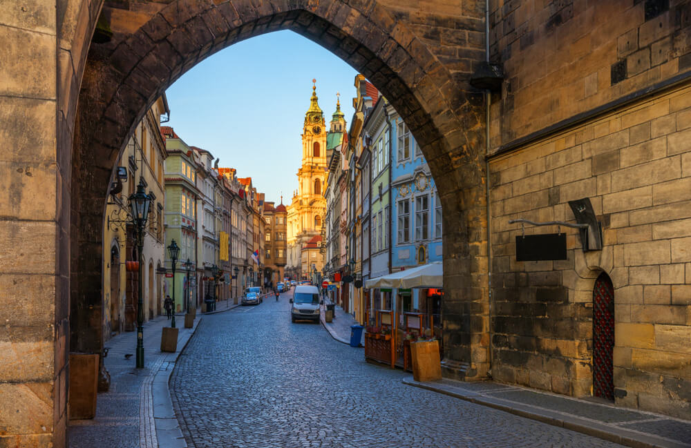Best places to visit in Prague: Buildings in the Malá Strana neighbourhood seen through an archway