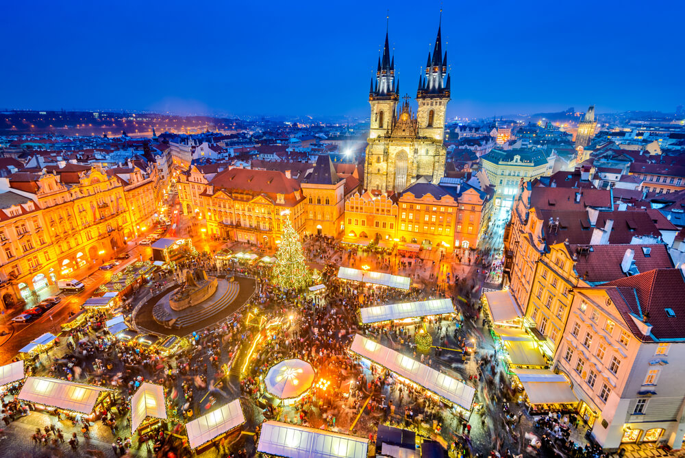 Prague main attractions: A wide-angle view of the main Old Town square at dusk
