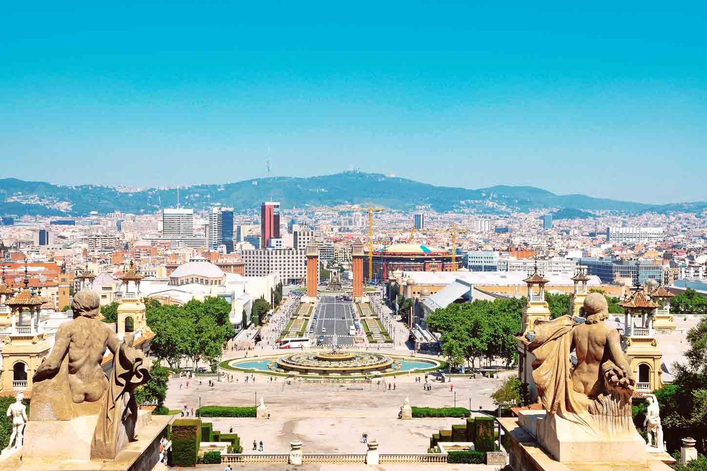 Best views in Barcelona: A statue on a rooftop and views across Barcelona