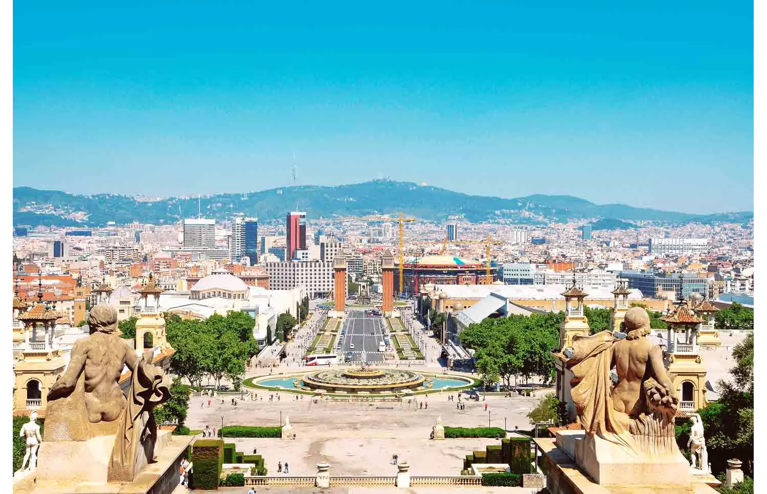 Best views in Barcelona: A statue on a rooftop and views across Barcelona