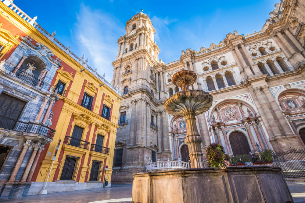 Winter sun bathing the historic plazas of Malaga