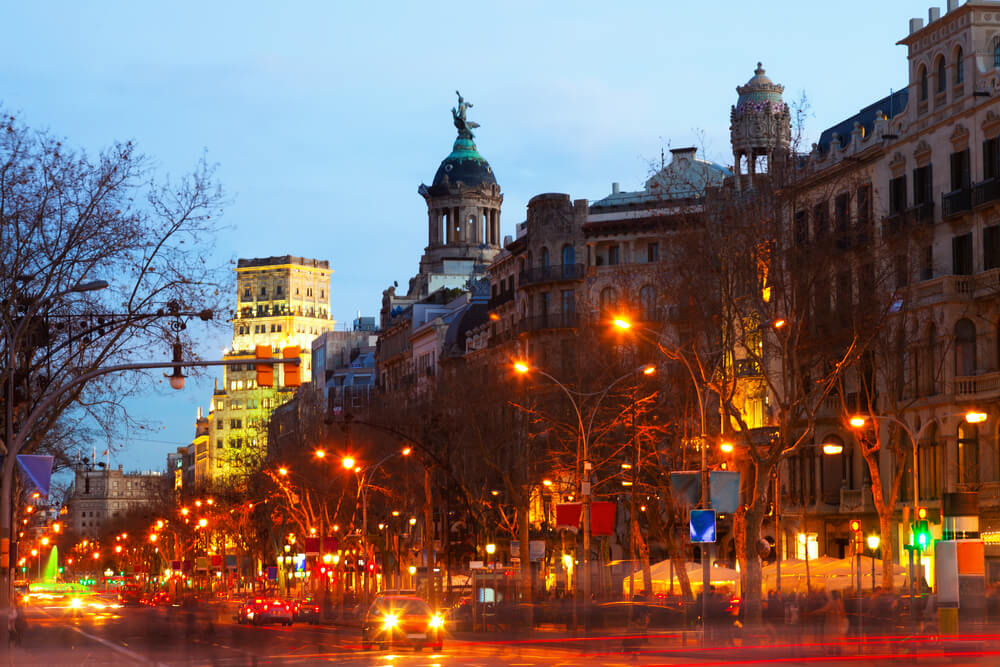 Best winter city breaks in Europe: city streets of Barcelona lit up at night