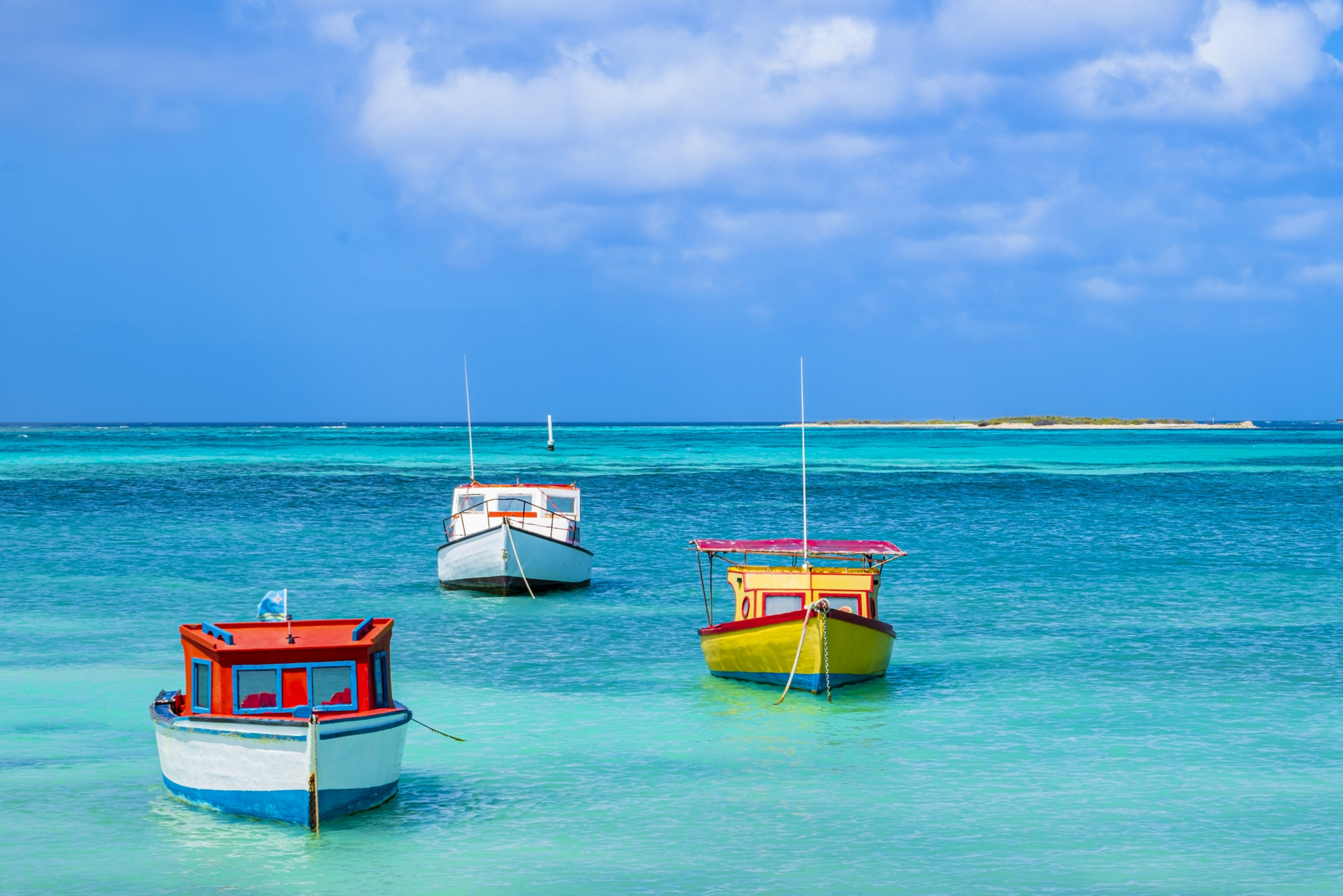 Add a splash of color to that monochrome mood with Blue Monday travel deals to Aruba