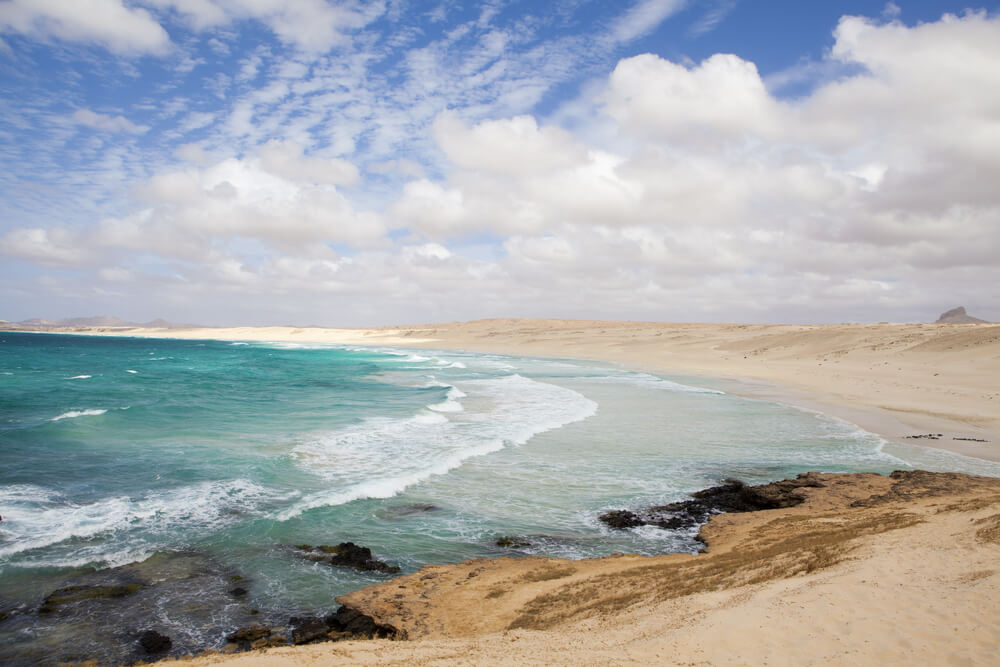 Bahia Beach Boa Vista: White sand shoreline broken by rocks and topaz sea