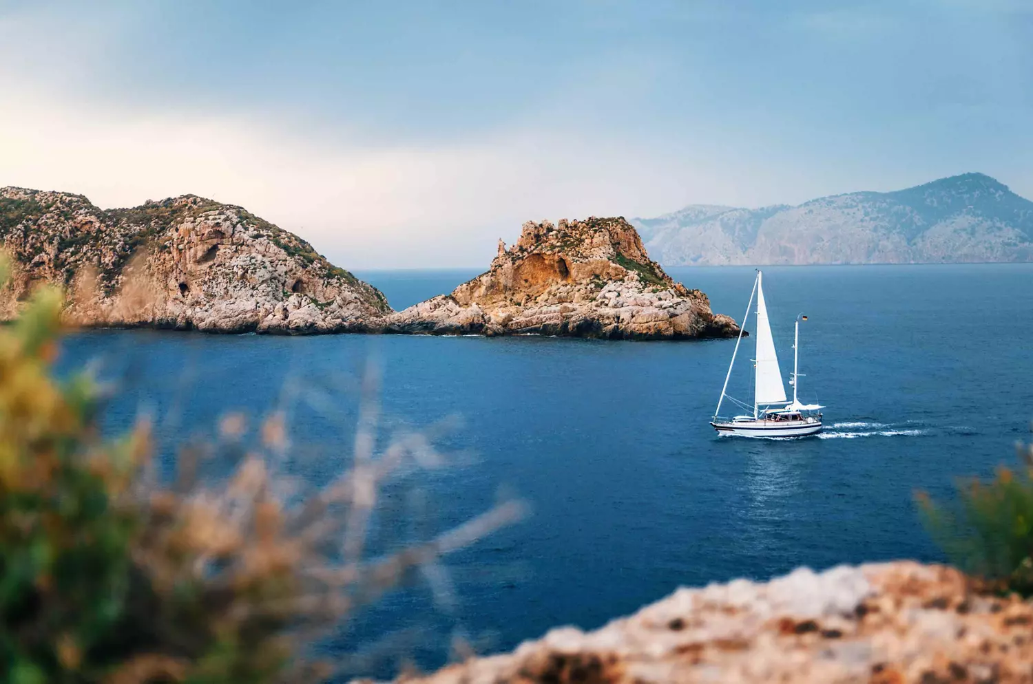 Boat trips in Mallorca: A wide open stretch of sea with a sailing boat on it