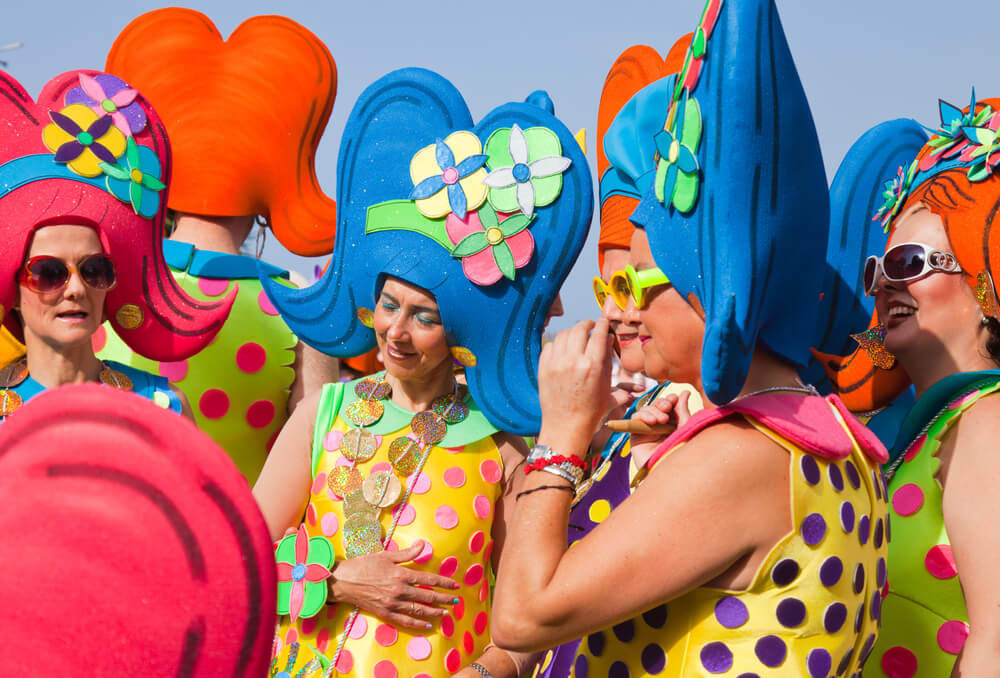Carnival in Tenerife: People dressed in colourful fancy dress costumes