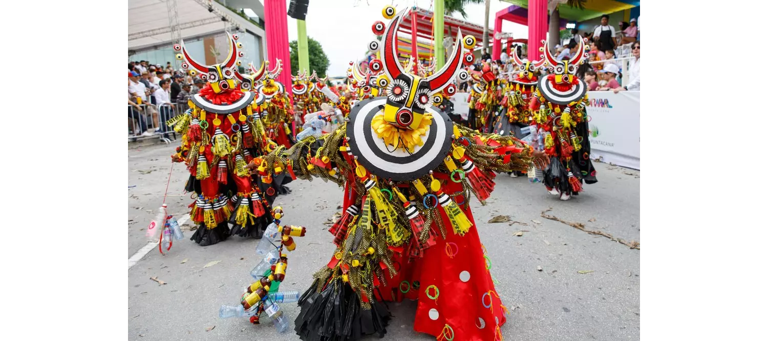 Carnaval de la Vega: A group of people dressed in yellow and red costumes with masks