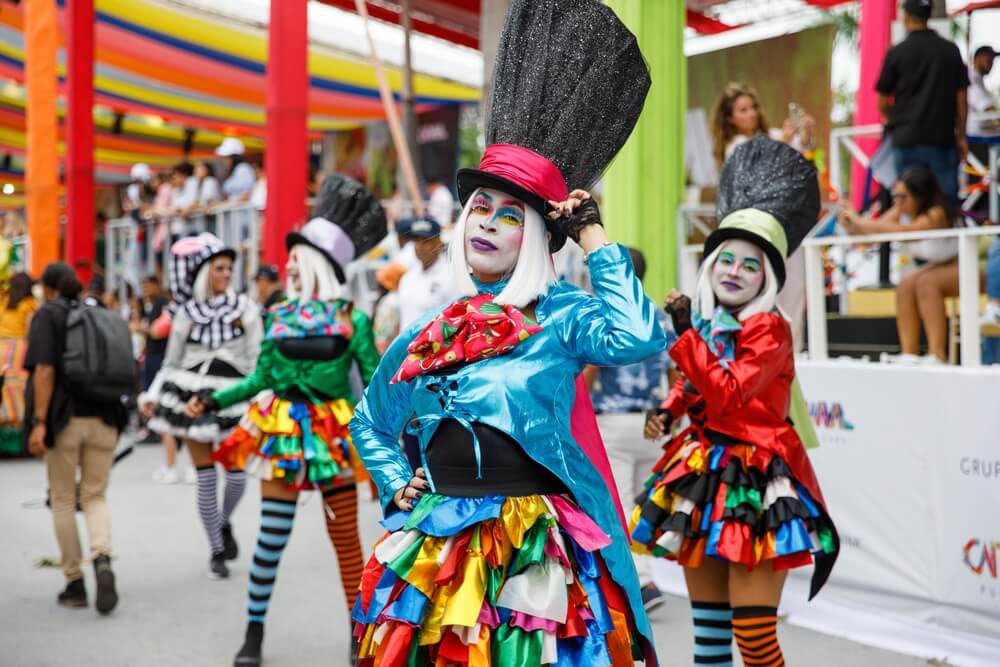 Carnival in the Dominican Republic: A group of women dressed in black top hats and colorful jackets