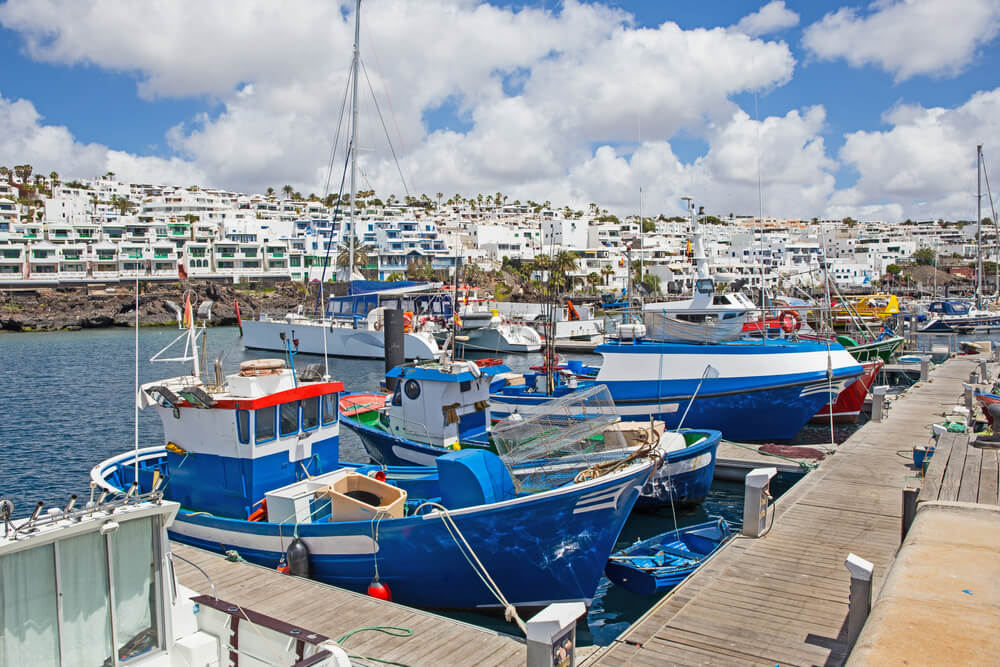 Cycling in Lanzarote: a close-up of the boats in the port of Puerto del Carmen