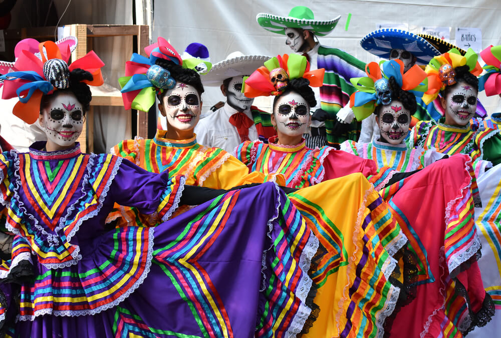 Day of the Dead around the world: Mexican women in a line in traditional dress