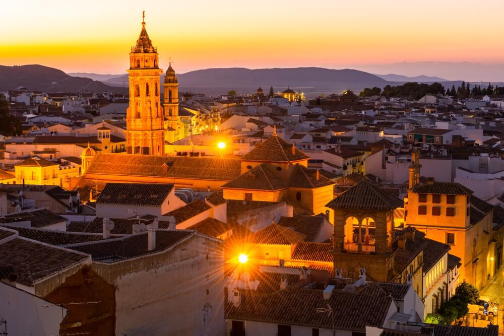 Antequera: The city skyline at sunset in a golden glow