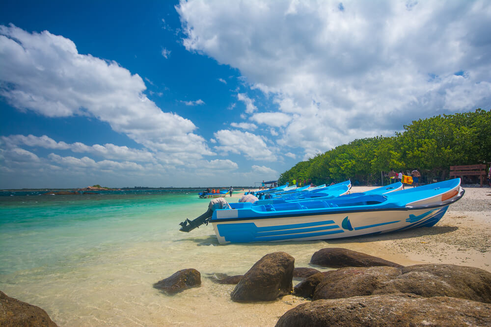Boats pulled up on a beach on Pigeon Island