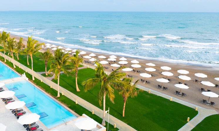 Luxury family beach resorts: Bird’s eye view of the sea and grounds of Mussanah Resort