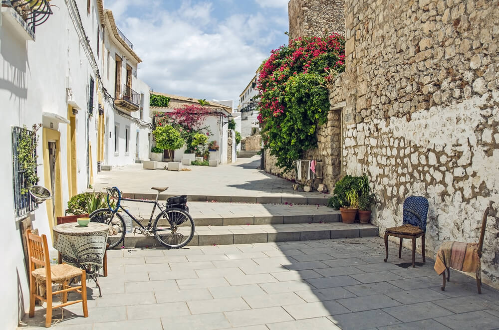 Family holidays in Ibiza: Street view of the stone-coloured Ibiza Old Town