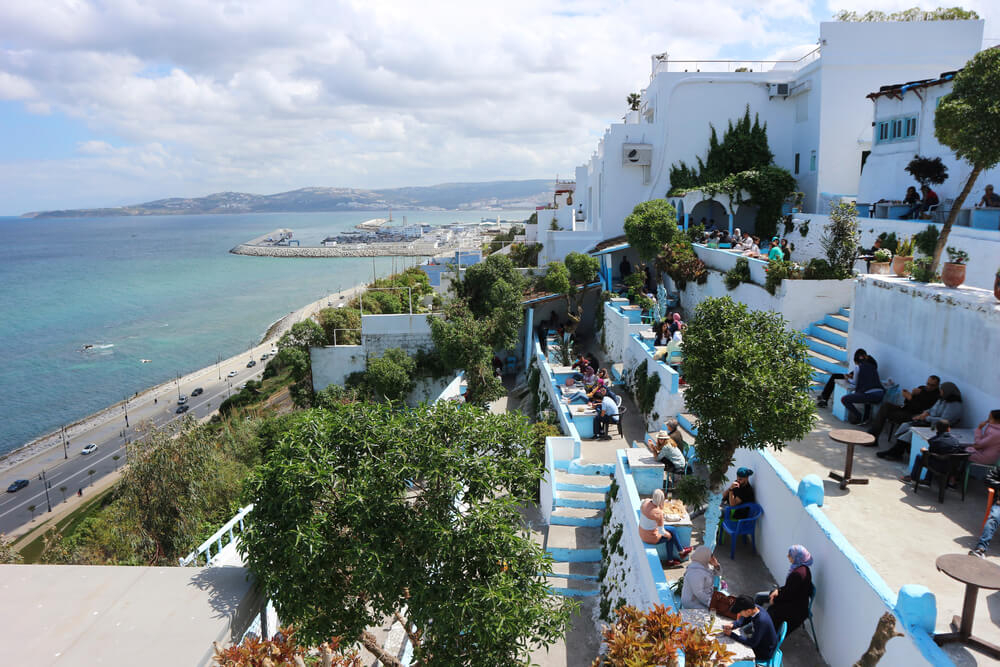 The whitewashed building and indigo terraces of Cafe Hafa, Tangier