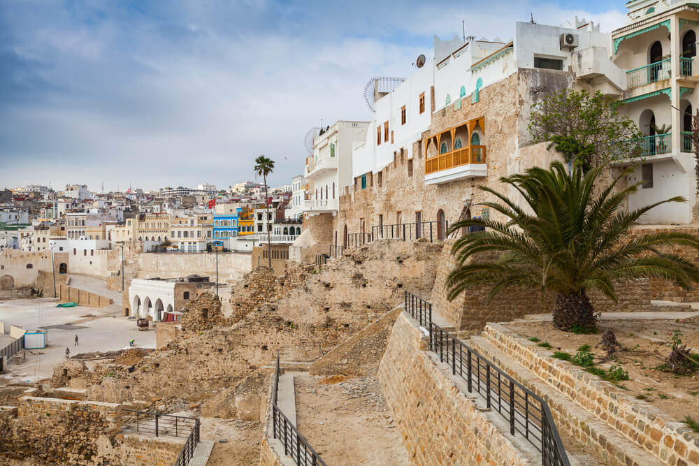 The sandstone buildings of the Tangier Medina with the city in the background