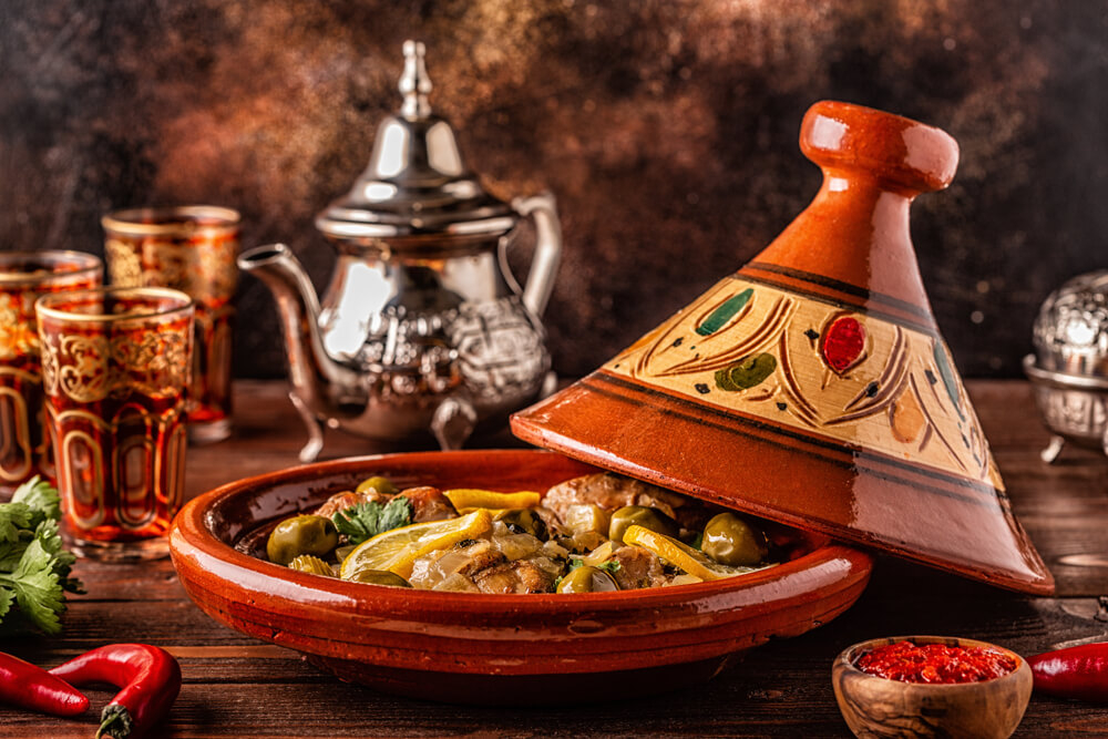 Tangier tours: A traditional Tangier tagine on a table with Moroccan tea cups