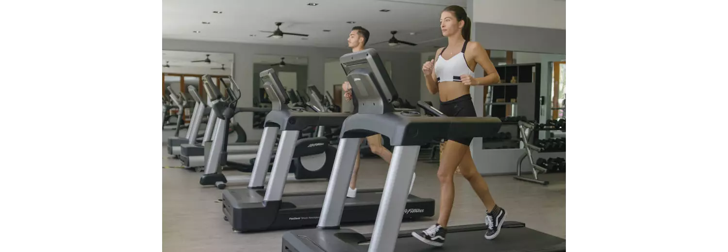 A woman working out on vacation in a hotel gym