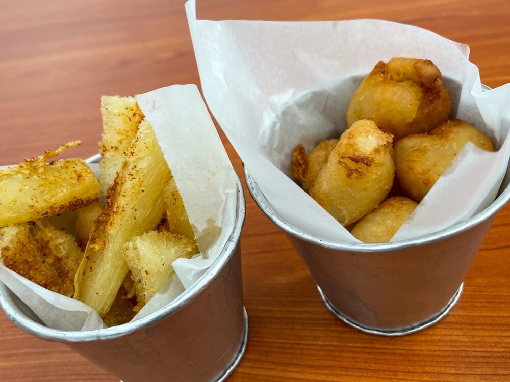 Food in Cuba: A steel pot of fried yuca in chips