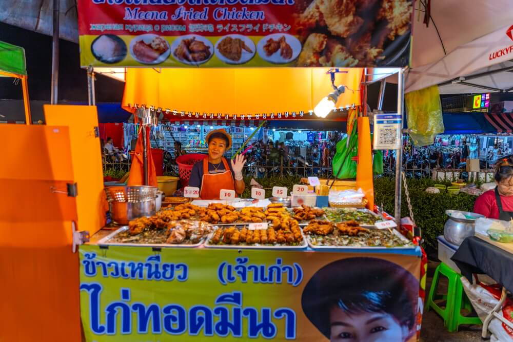 Street Food: A woman at a street food stall in Thailand