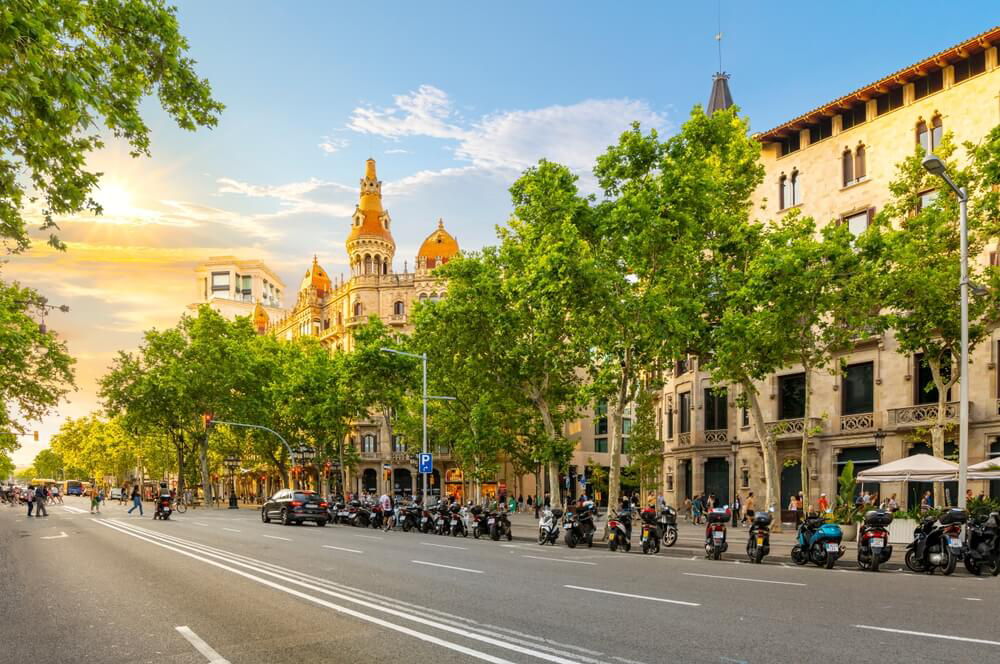 Eixample: A typical street with ornate buildings and wide roads in Barcelona