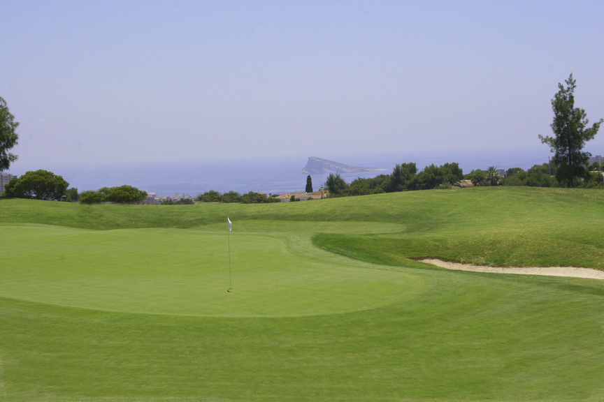 Ultimate golf trip: A close-up of a hole on a golf course with sea views