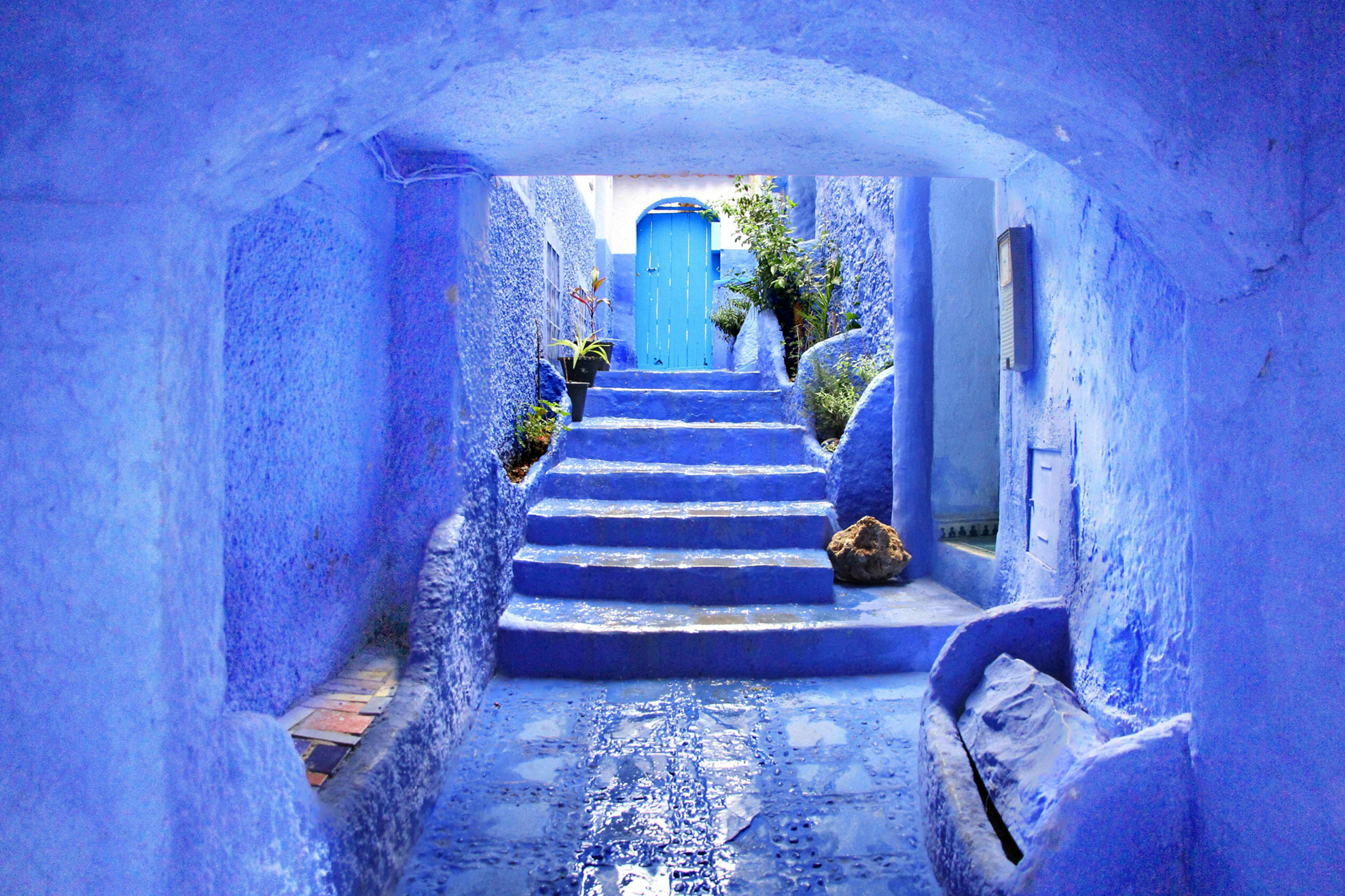 Happy place: Blue painted stone building with Moroccan decoration