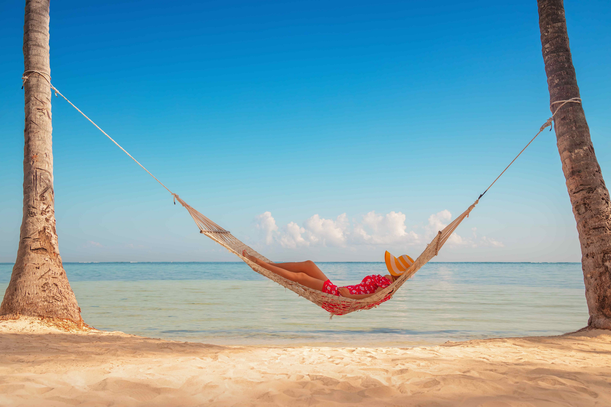 Punta Cana: Woman on a hammock between two trees