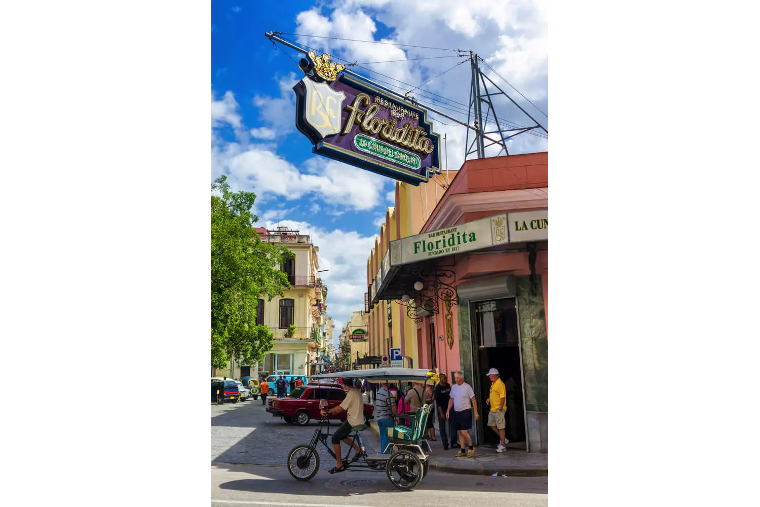 La Floridita: A corner street view of the iconic sign and pink facade of La Floridita, Havana