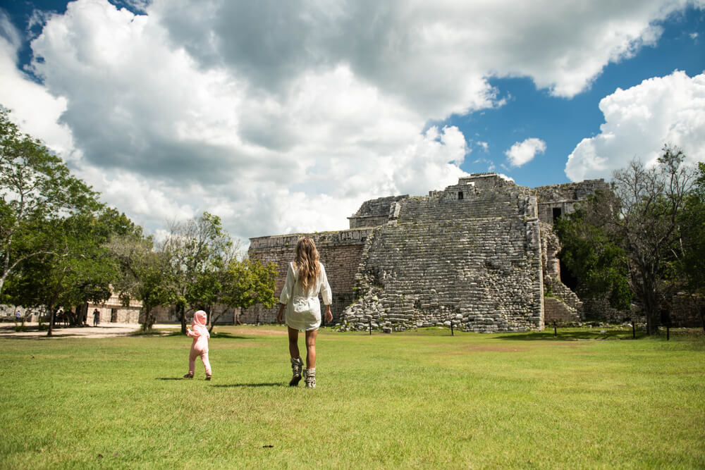 Holiday destinations with baby: Mother and child exploring Mayan ruins in Mexico