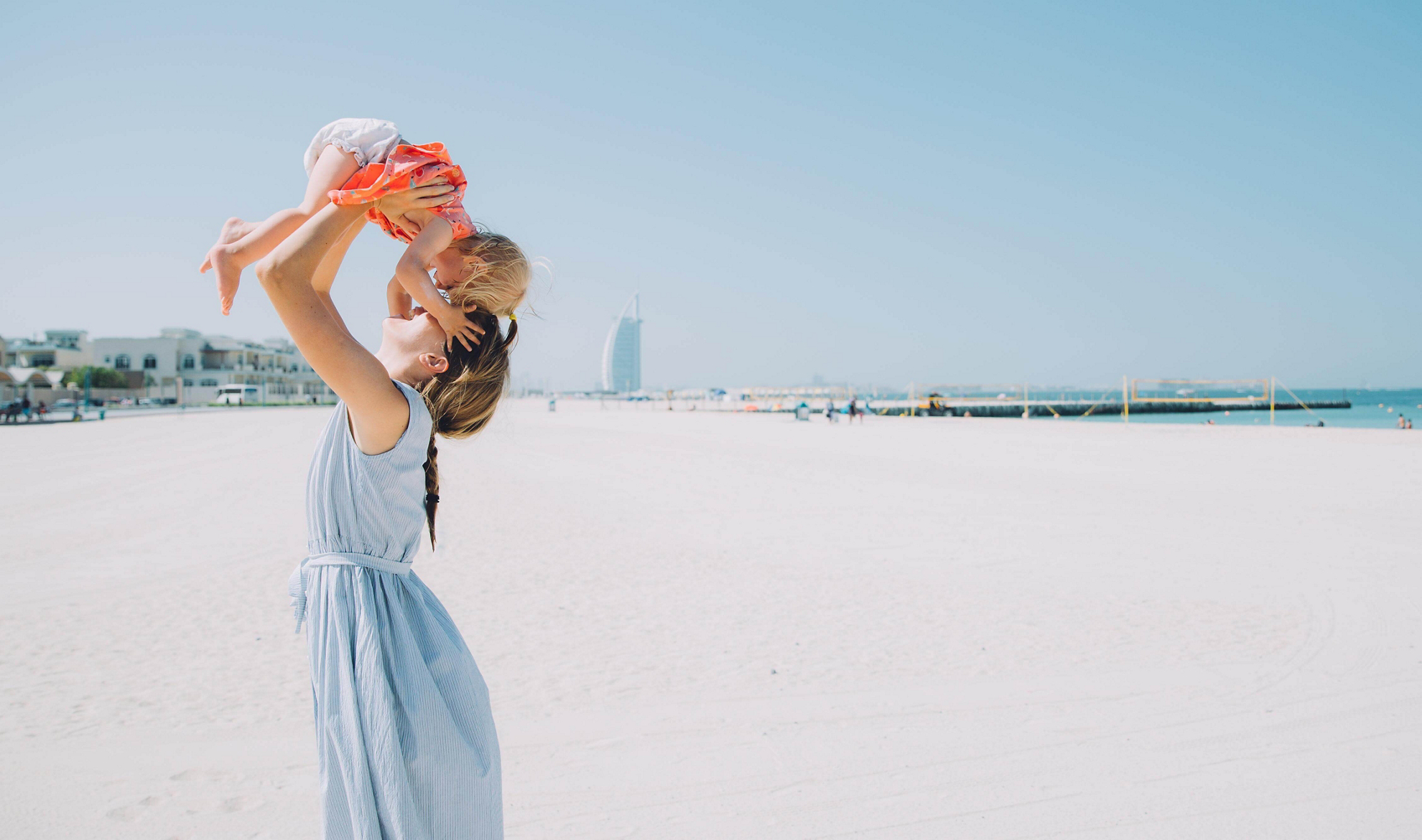 Holiday destinations with baby: Mother and baby on a beach