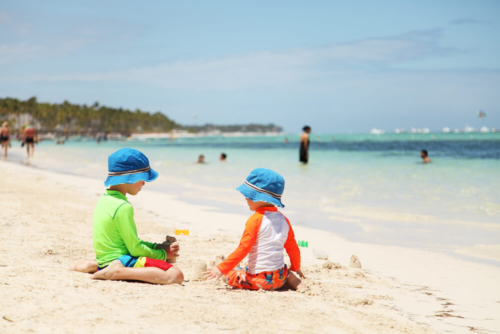 Holiday-destinations-with-baby: Two babies playing on the beach in Punta Cana