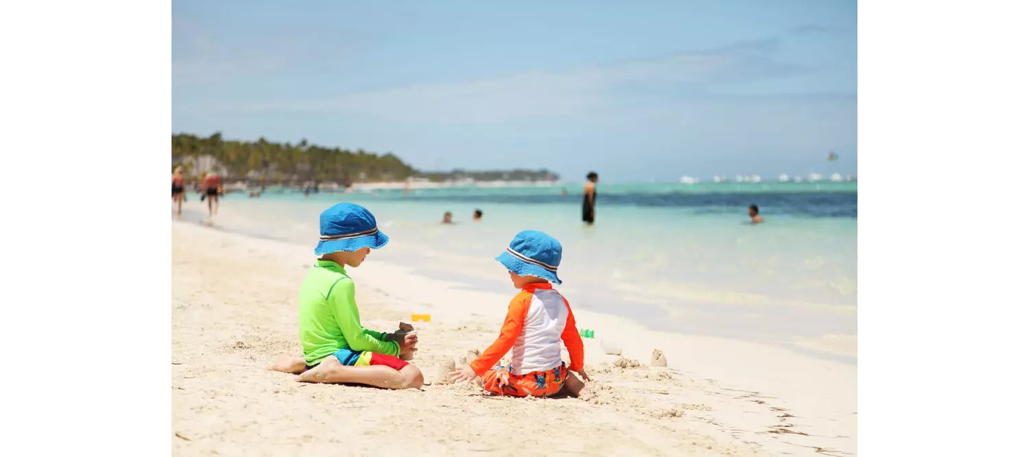 Holiday-destinations-with-baby: Two babies playing on the beach in Punta Cana