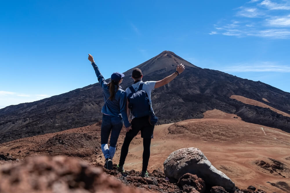 Newlyweds enjoying their honeymoon in Spain at Teide National Park.