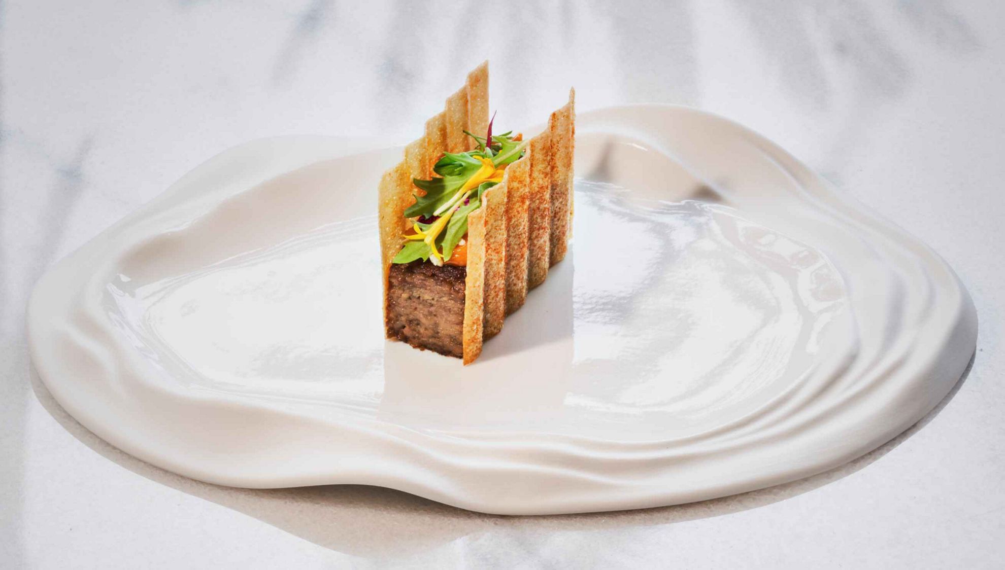 Poemas by Hermanos Padron: a white plate with a small starter