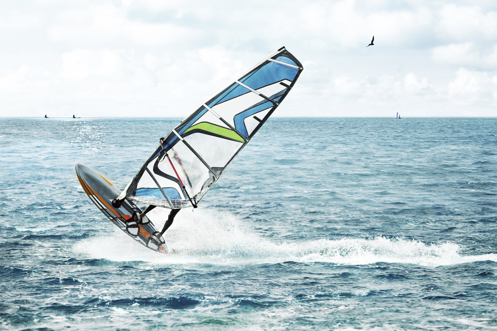 Windsurfer, fun in the blue ocean with waves