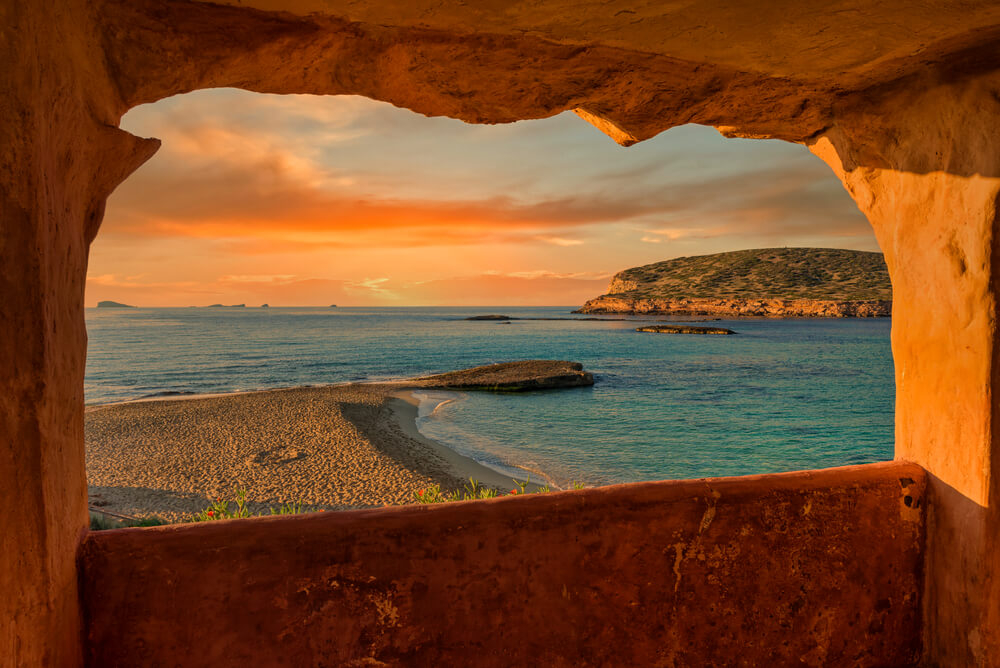 Beach Sunset: A beach in Ibiza cast in a golden glow at sunset