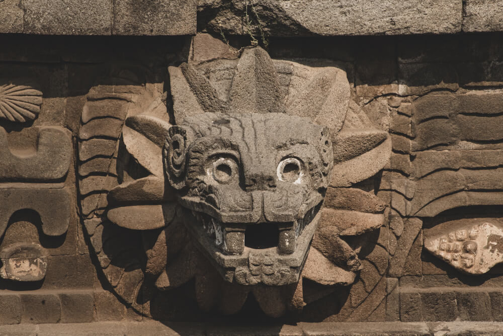 Kukulcan Boulevard: A stone carving of the Kukulcan Mayan God