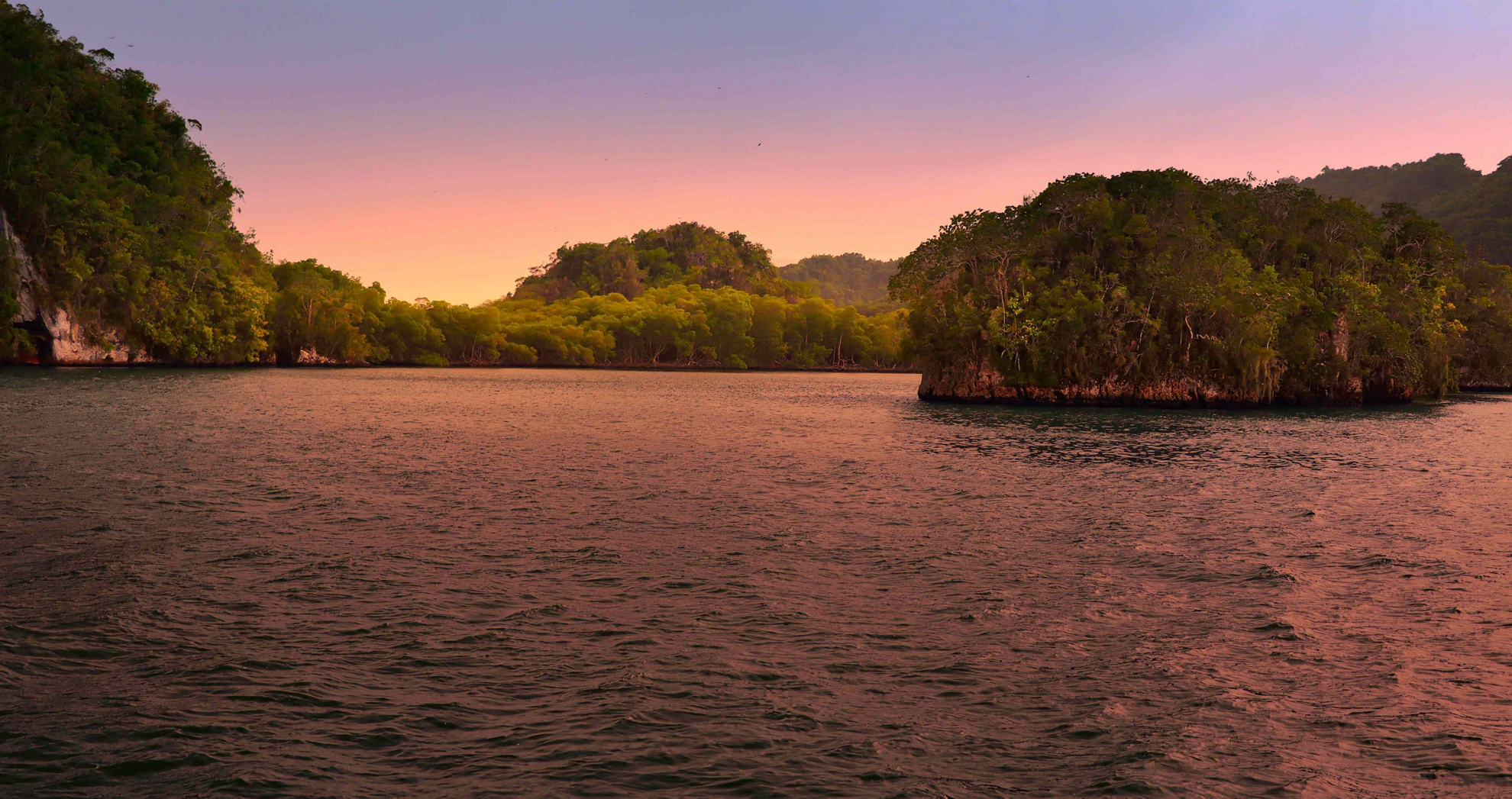 View of Los Haitises from a boat at sunset.