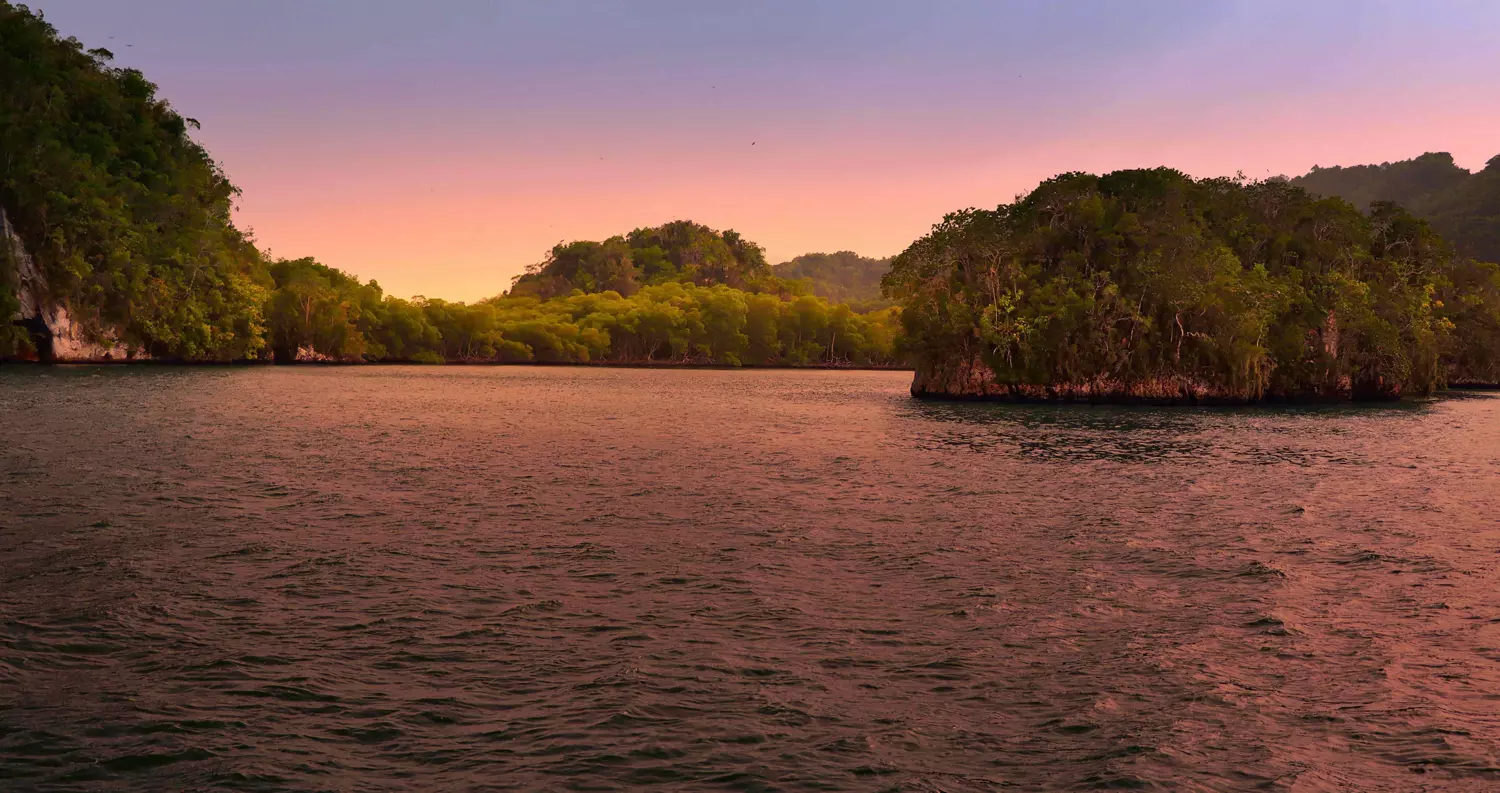 View of Los Haitises from a boat at sunset.